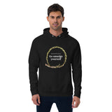White man wearing a black hoodie that says respectfully go smudge yourself
