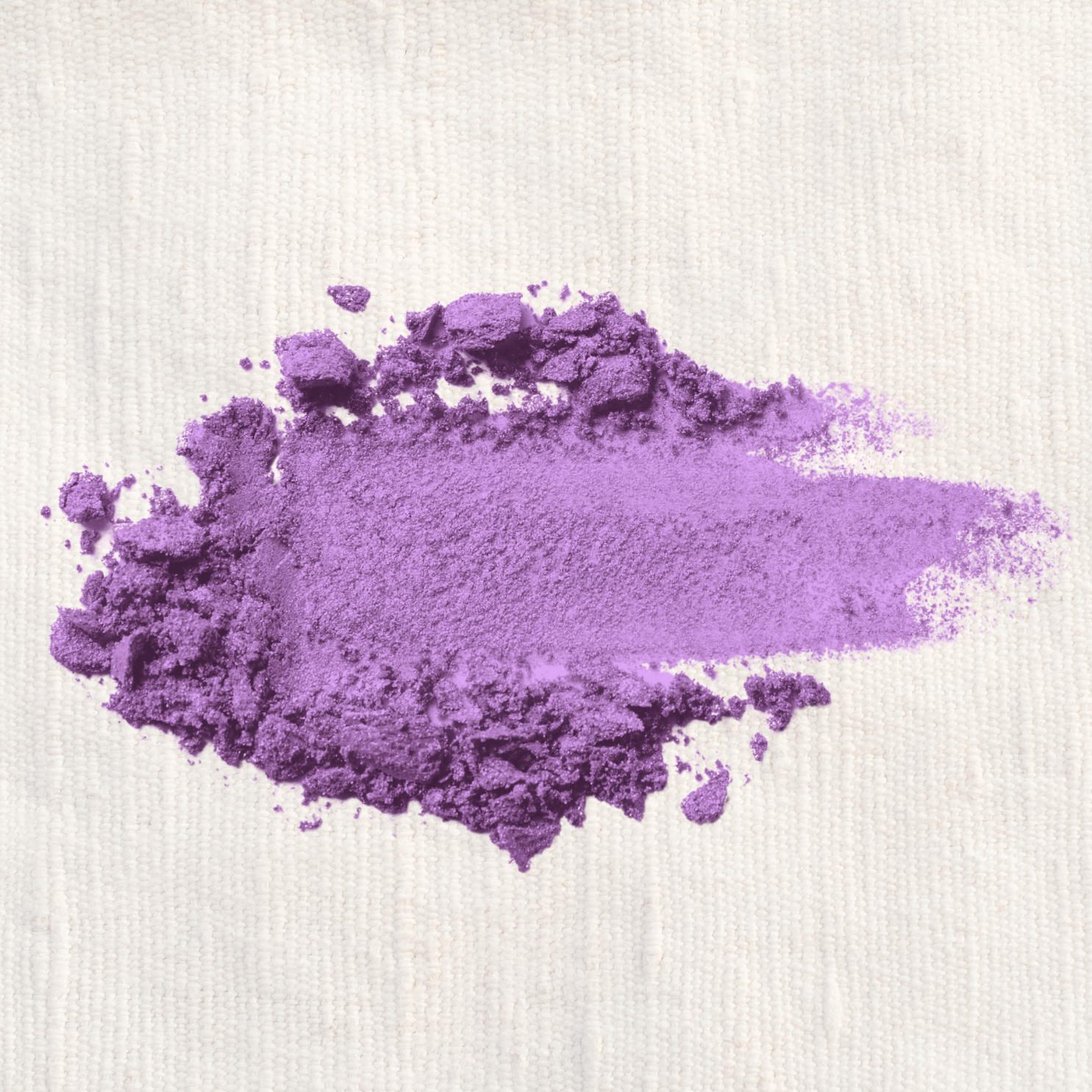 An image of a vibrant purple smudge of Lakota Made's Sastan Purple Eyeshadow on white paper. 